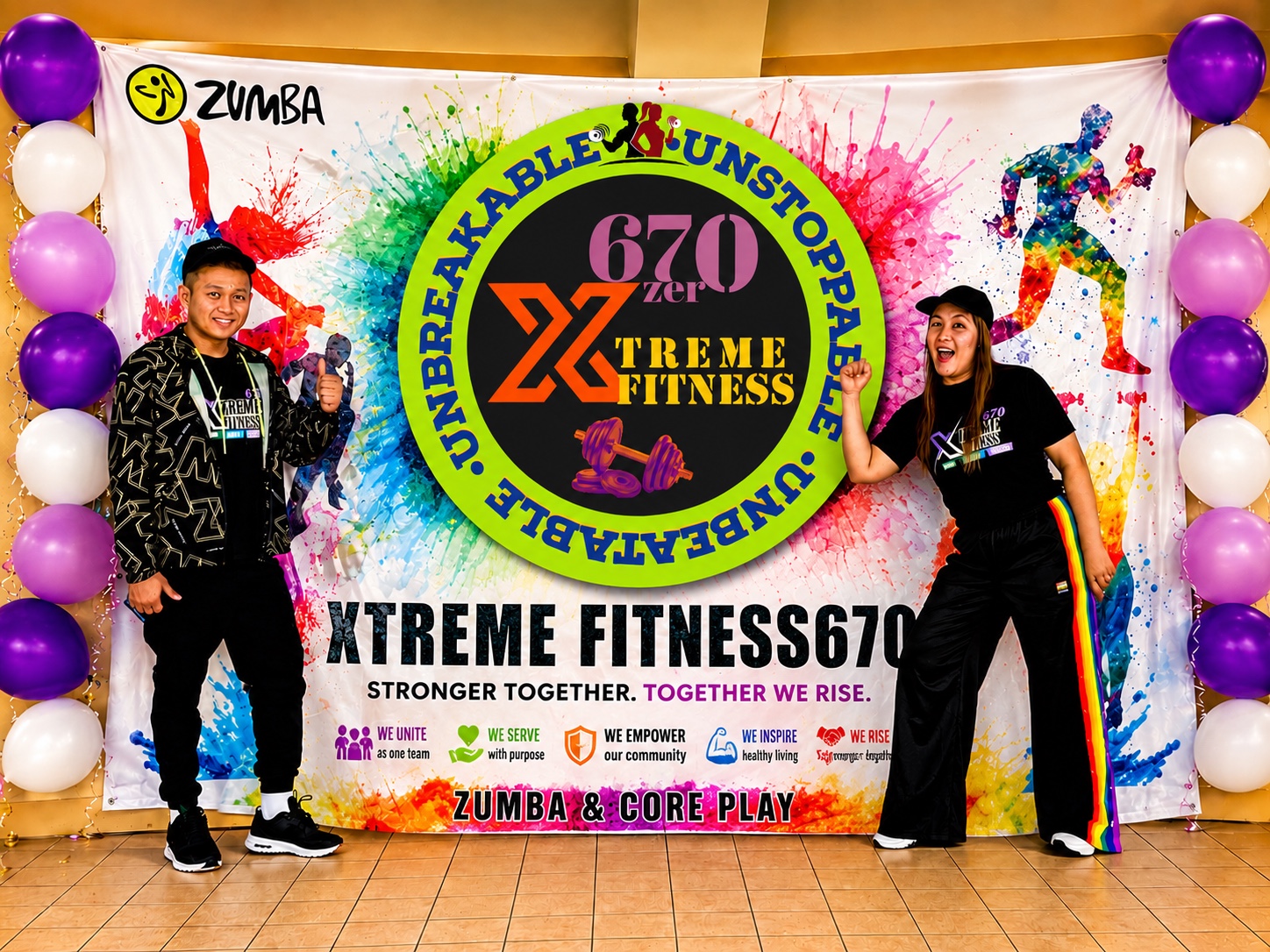 Zin Mitch and Coach Angelo beside the large Xtreme Fitness670 logo